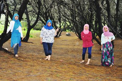 Group of people standing in the forest