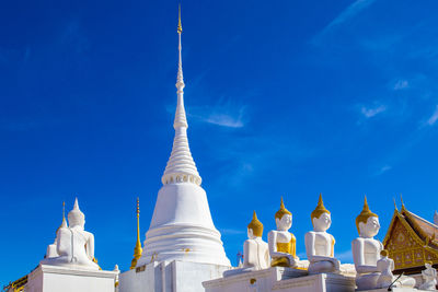 Low angle view of building against blue sky