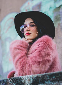 Portrait of beautiful young woman wearing sunglasses