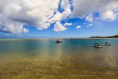 Scenic view of sea against cloudy sky