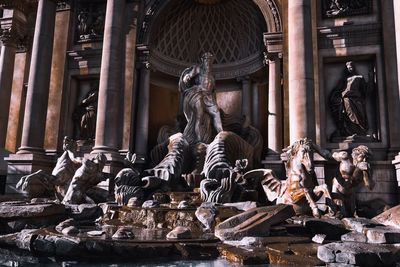 Statue outside temple against building