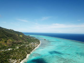 Scenic view of sea against blue sky