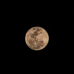 Low angle view of moon against clear sky at night