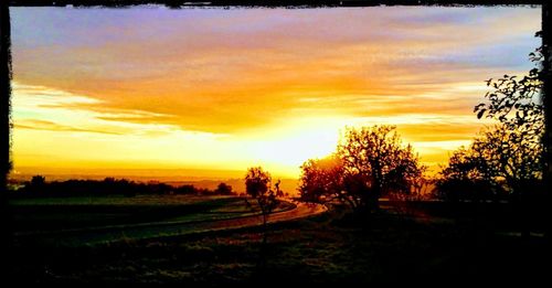 Scenic view of landscape against sky during sunset