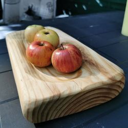 High angle view of apples in container on table