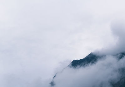 Scenic view of mountain against cloudy sky