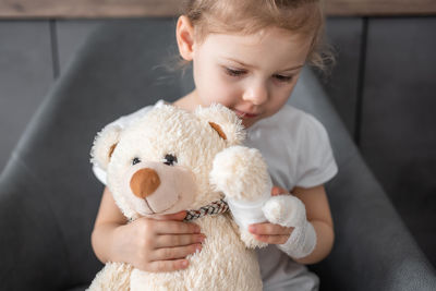 Close-up of cute girl with stuffed toy