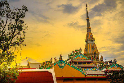 Low angle view of building against sky during sunset