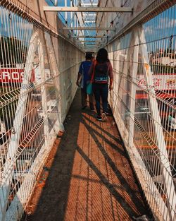 Rear view of men walking outdoors