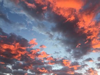 Low angle view of cloudy sky at sunset