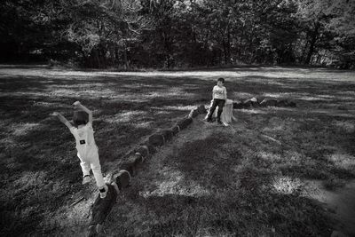 Siblings playing at park