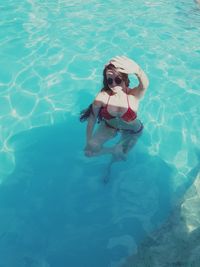 High angle view of woman swimming in pool