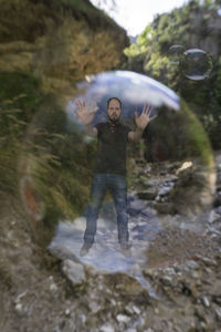 Full length of man jumping in water