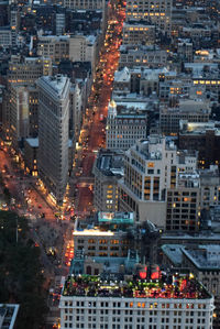 View of buildings in city at dusk