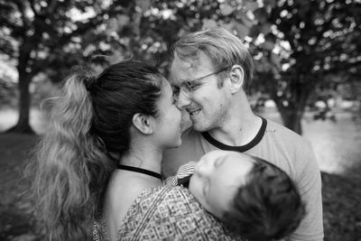Portrait of couple kissing outdoors