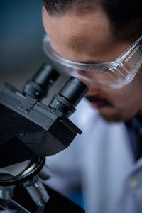 Close-up of scientist working at laboratory