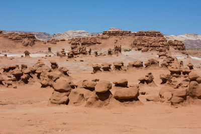 View of sand dunes against clear sky