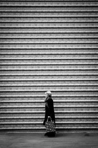 Woman standing in the dark