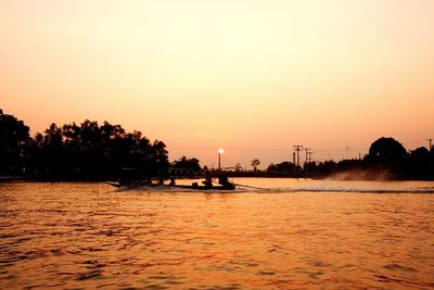 Scenic view of sea against orange sky