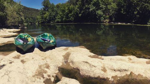 High angle view of rocks by lake