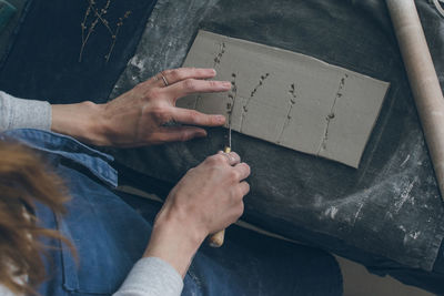 Close-up of woman making pottery