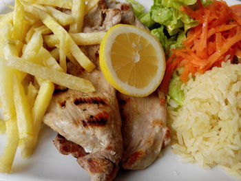 Close-up of meat with rice served in plate