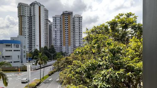 Street amidst buildings against sky