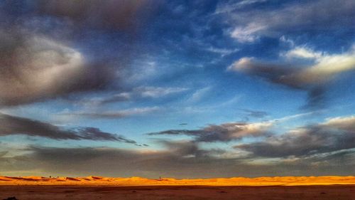 Scenic view of landscape against sky during sunset