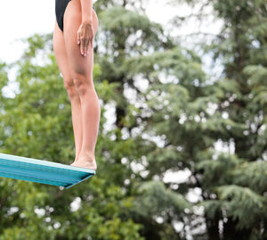 Low section of woman standing on edge