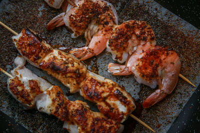 High angle view of meat on barbecue grill