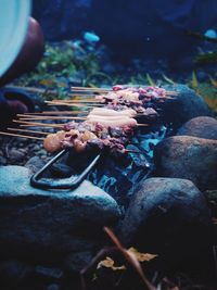 High angle view of meat on barbecue grill