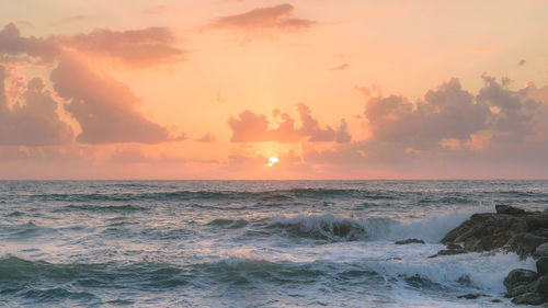 Scenic view of sea against sky during sunset