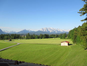 View of fields against mountain range