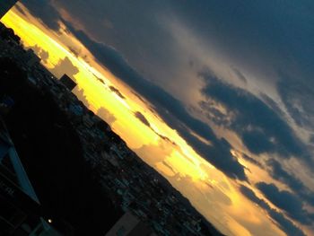 Low angle view of dramatic sky at sunset