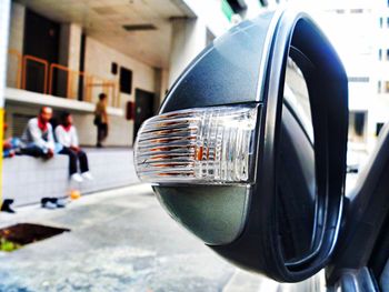Close-up of car on road