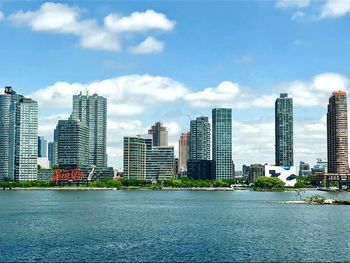Modern buildings in city against sky