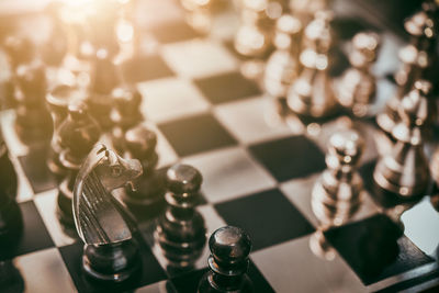 High angle view of chess pieces on board