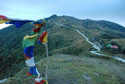Multi colored praying flags against mountain