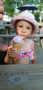 High angle view of woman holding ice cream