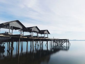 Pier over sea against sky