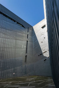 Low angle view of modern building against clear sky