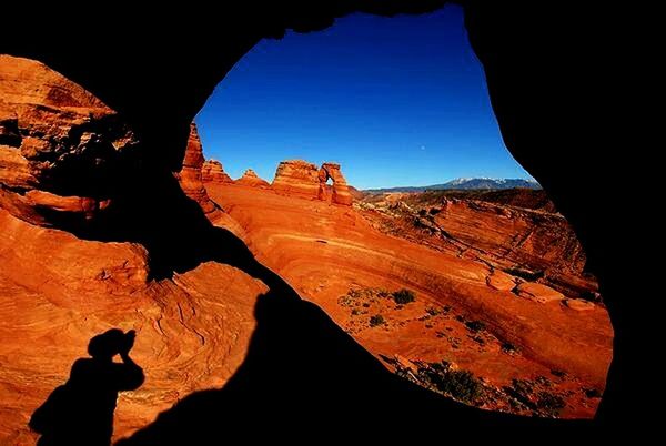 silhouette, men, mountain, lifestyles, rock formation, leisure activity, travel, sunlight, tourism, tranquility, unrecognizable person, sky, physical geography, travel destinations, rock - object, nature, landscape, geology