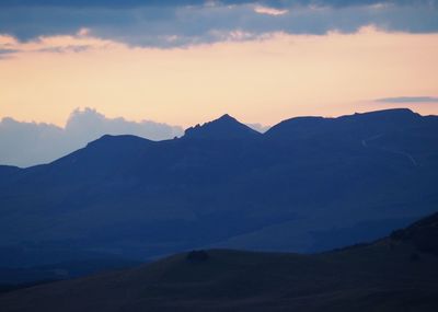 Scenic view of mountains against sky during sunset