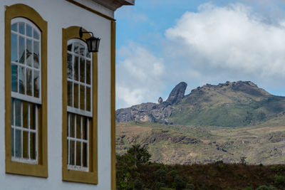 Built structure on mountain against sky