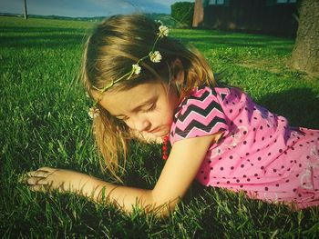 Woman relaxing on grassy field