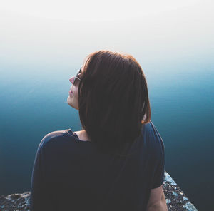 Rear view of woman looking at sea