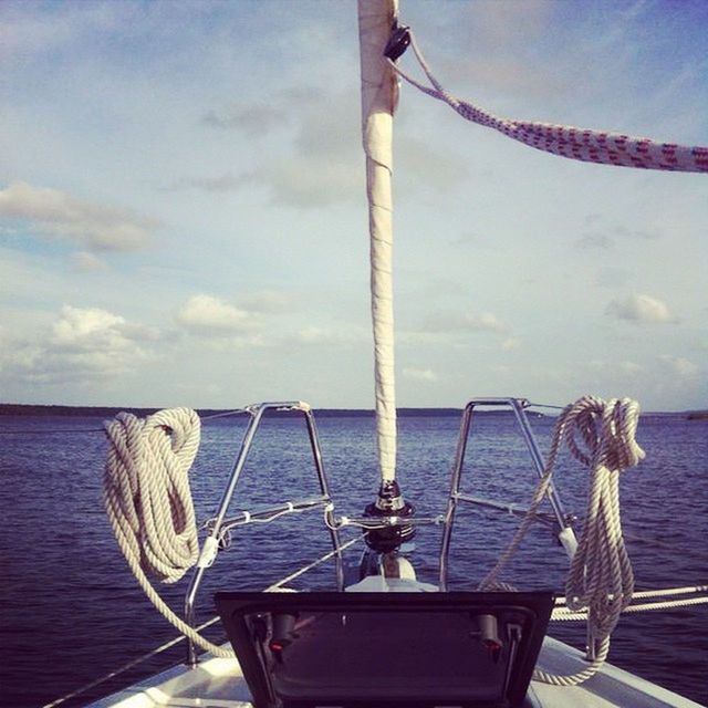 sea, water, nautical vessel, horizon over water, sky, boat, rope, sailboat, transportation, mast, moored, nature, rippled, day, tranquility, mode of transport, cloud - sky, no people, hanging, outdoors