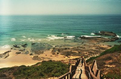 Scenic view of sea against blue sky