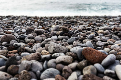 Close-up of stones on beach