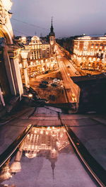 High angle view of city lit up at night